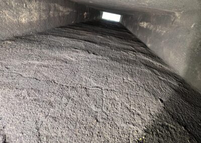 A large pile of dirt in an air duct.